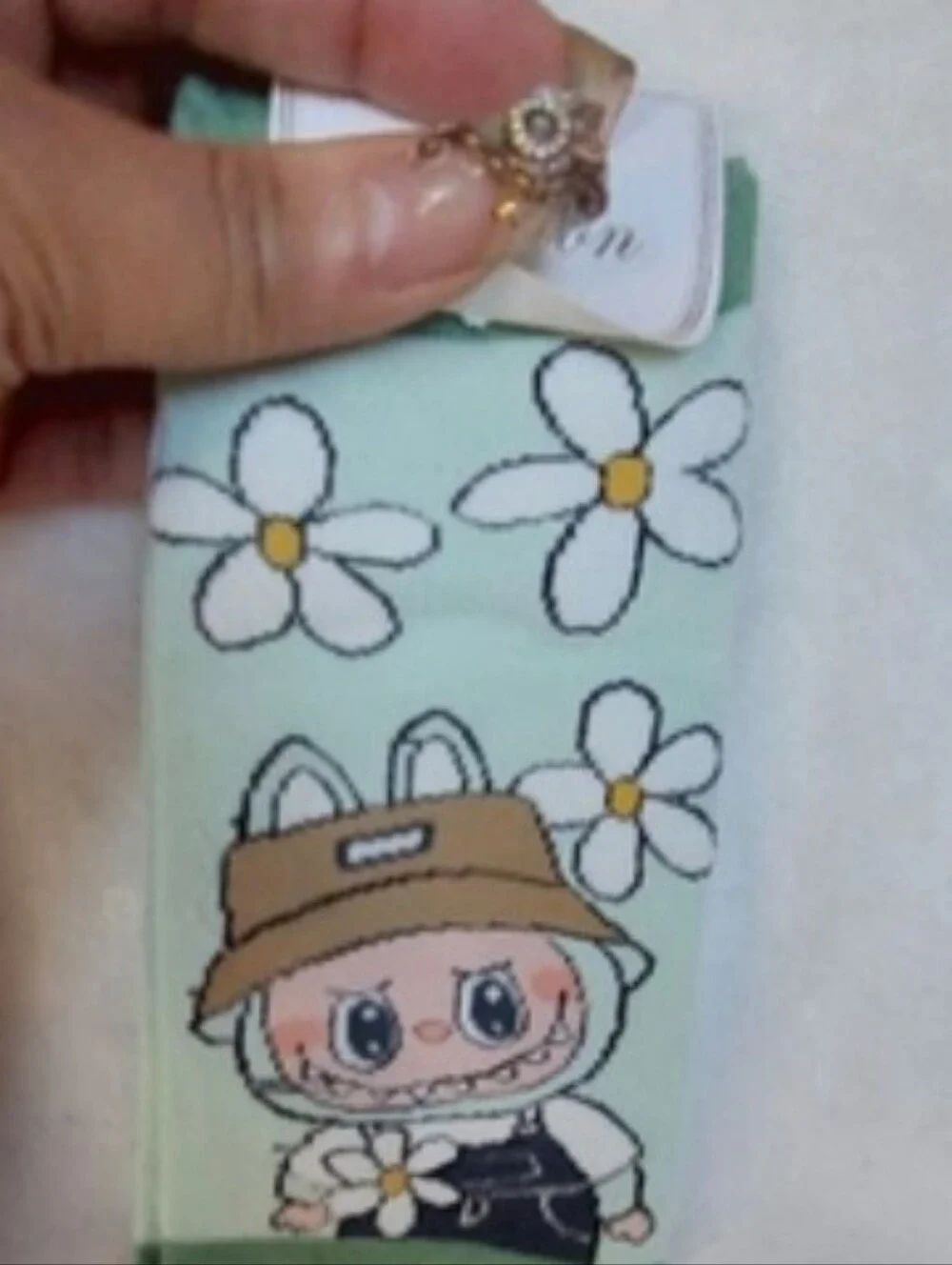 5 pairs of the ugly but cute Labubu Character footies Socks.